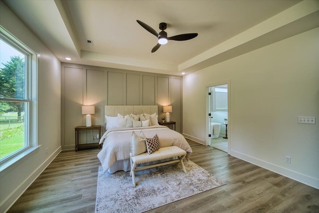 824 Lower Mill Rd, Hixson, TN 37343 - bedroom featuring wood finished floors, a raised ceiling, and ceiling fan