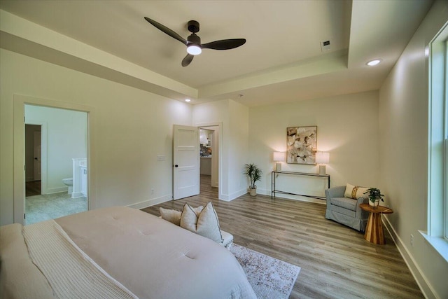 824 Lower Mill Rd, Hixson, TN 37343 - bedroom featuring recessed lighting, wood finished floors, ensuite bath, and a tray ceiling