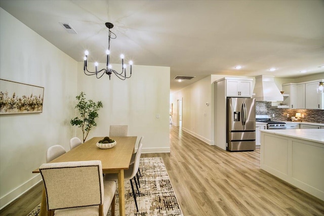 824 Lower Mill Rd, Hixson, TN 37343 - dining space with light wood-style floors, a chandelier, and recessed lighting