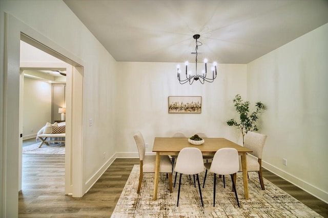 824 Lower Mill Rd, Hixson, TN 37343 - dining room with dark wood-type flooring and a chandelier