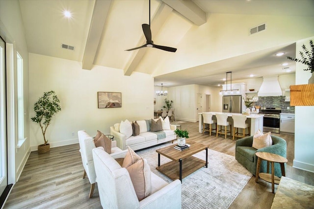 824 Lower Mill Rd, Hixson, TN 37343 - living room with high vaulted ceiling, a chandelier, light wood finished floors, a ceiling fan, and beam ceiling
