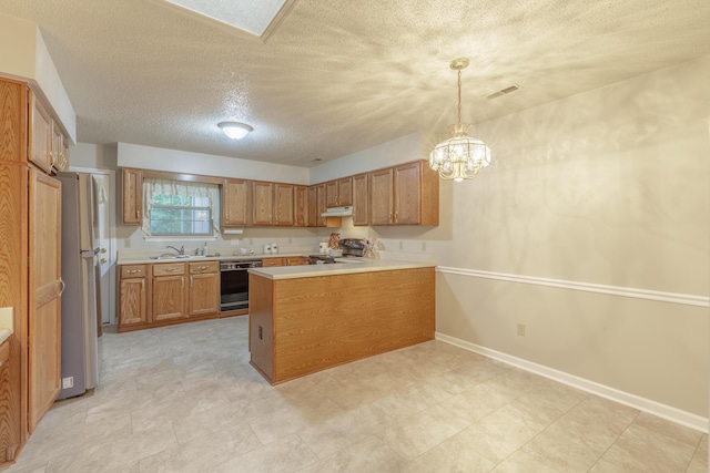 6580 Hickory Meadow Dr, Chattanooga, TN 37421 - kitchen featuring black dishwasher, brown cabinetry, a peninsula, range, and a textured ceiling