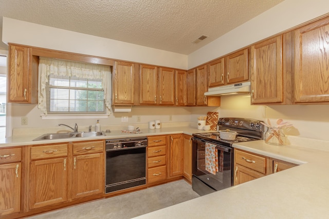 6580 Hickory Meadow Dr, Chattanooga, TN 37421 - kitchen with black appliances, under cabinet range hood, light countertops, a textured ceiling, and brown cabinetry