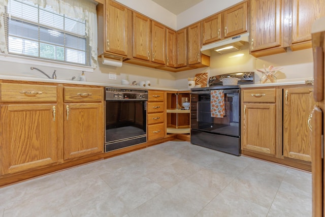 6580 Hickory Meadow Dr, Chattanooga, TN 37421 - kitchen featuring black appliances, under cabinet range hood, light countertops, and brown cabinets