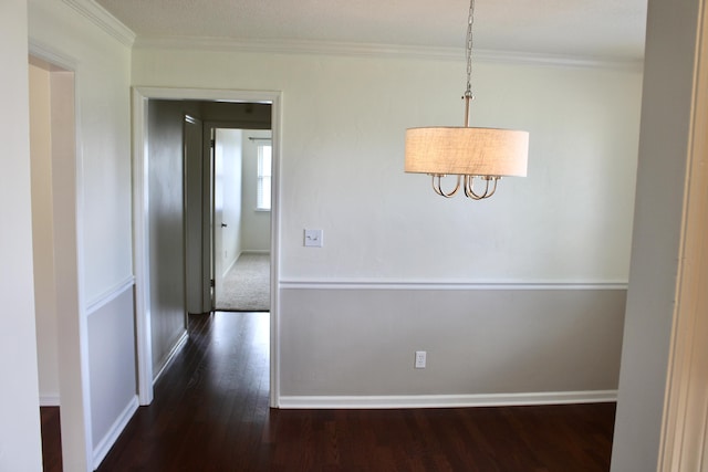 8257 Tiber Rd, Chattanooga, TN 37421 - unfurnished dining area featuring dark wood-style flooring, crown molding, and a chandelier
