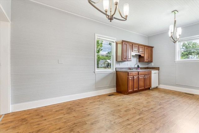 1 W 10th St, Chickamauga, GA 30707 - kitchen featuring a chandelier, white dishwasher, plenty of natural light, and light wood-type flooring
