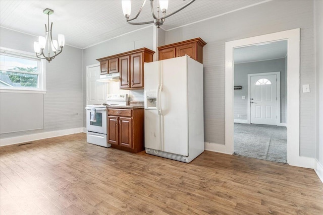 1 W 10th St, Chickamauga, GA 30707 - kitchen with white appliances, a chandelier, under cabinet range hood, and brown cabinets