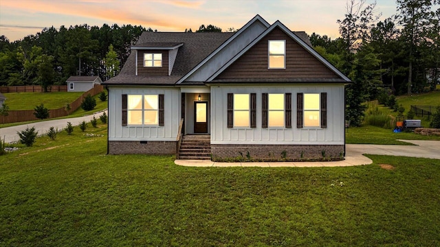 853 Dedmon Rd, Ringgold, GA 30736 - view of front facade featuring a front lawn, board and batten siding, crawl space, and a shingled roof