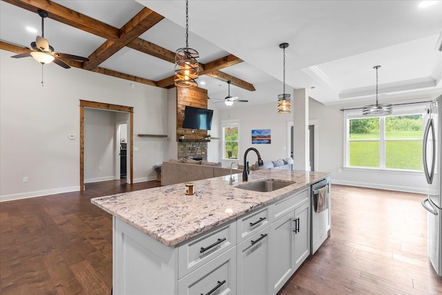 853 Dedmon Rd, Ringgold, GA 30736 - kitchen featuring ceiling fan, appliances with stainless steel finishes, a stone fireplace, open floor plan, and pendant lighting