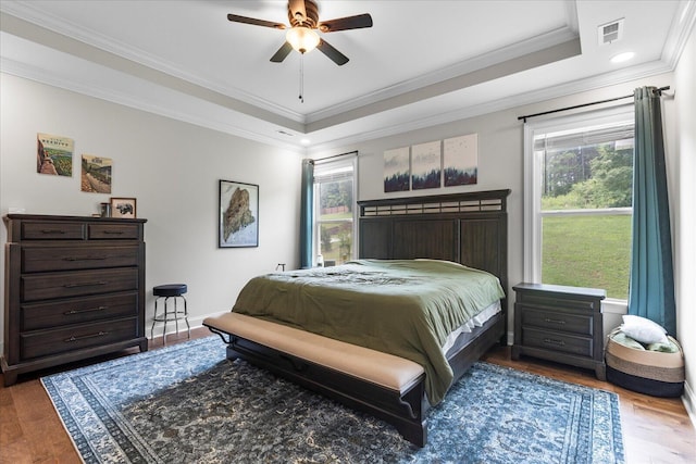 853 Dedmon Rd, Ringgold, GA 30736 - bedroom with a tray ceiling, crown molding, wood finished floors, recessed lighting, and ceiling fan