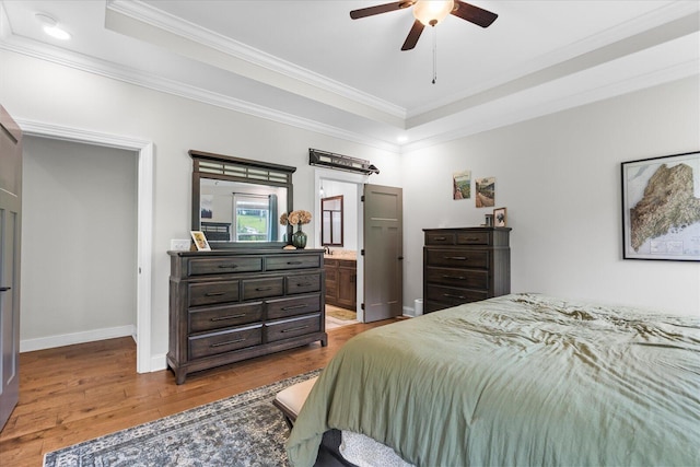 853 Dedmon Rd, Ringgold, GA 30736 - bedroom featuring a raised ceiling, ornamental molding, wood finished floors, connected bathroom, and ceiling fan