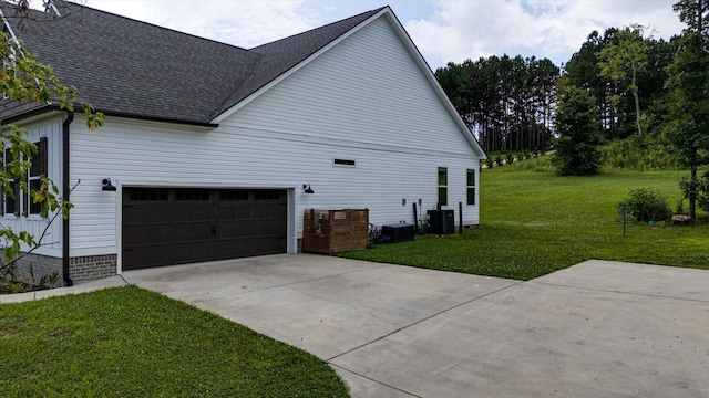 853 Dedmon Rd, Ringgold, GA 30736 - view of home's exterior featuring a lawn, roof with shingles, concrete driveway, and a garage