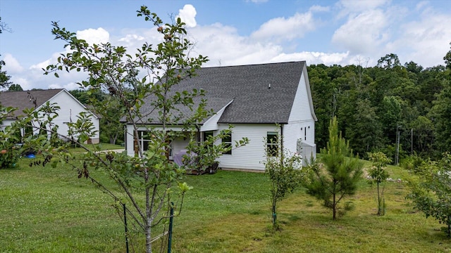 853 Dedmon Rd, Ringgold, GA 30736 - back of house featuring roof with shingles and a yard