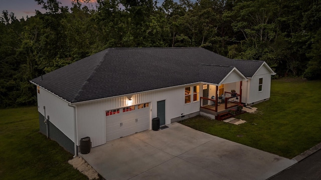 111 Oak Meadow Dr, Dunlap, TN 37327 - view of front of home featuring a front lawn, a shingled roof, an attached garage, and driveway