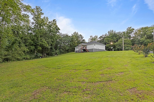 111 Oak Meadow Dr, Dunlap, TN 37327 - view of green lawn featuring a wooden deck and stairway