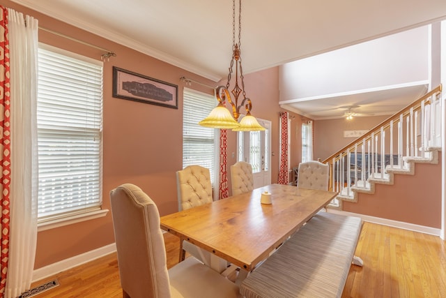 199 Falcons View Dr, Ringgold, GA 30736 - dining room with light wood-style flooring, crown molding, a ceiling fan, and stairs