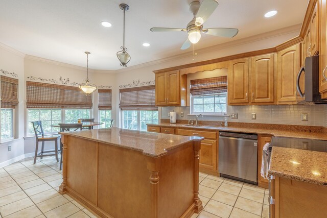 199 Falcons View Dr, Ringgold, GA 30736 - kitchen featuring appliances with stainless steel finishes, a kitchen island, light stone countertops, decorative backsplash, and ornamental molding