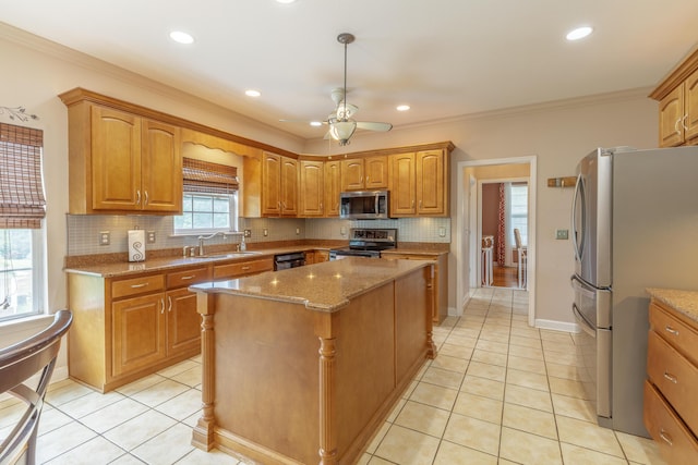 199 Falcons View Dr, Ringgold, GA 30736 - kitchen featuring stainless steel appliances, a kitchen island, light stone countertops, decorative backsplash, and light tile patterned floors