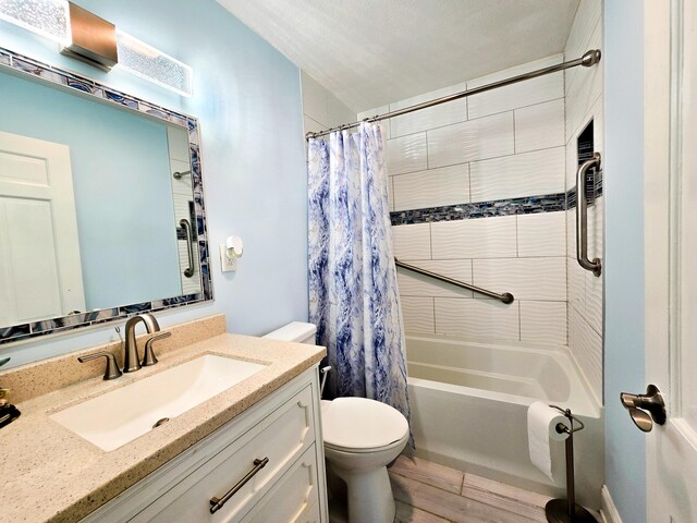 4619 Lake Haven Dr, Chattanooga, TN 37416 - full bathroom featuring vanity, shower / bath combo, and wood finished floors