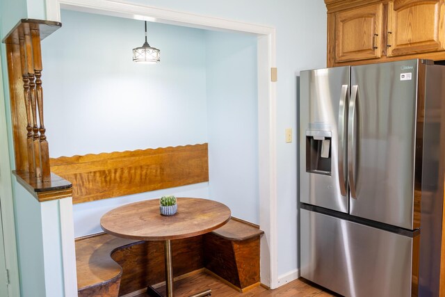 4619 Lake Haven Dr, Chattanooga, TN 37416 - kitchen featuring stainless steel refrigerator with ice dispenser, light wood-type flooring, and decorative light fixtures