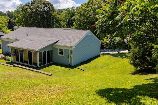 4619 Lake Haven Dr, Chattanooga, TN 37416 - rear view of house featuring a sunroom, a yard, and a shingled roof