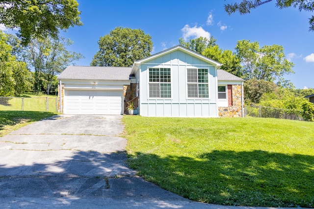 4619 Lake Haven Dr, Chattanooga, TN 37416 - view of front facade featuring board and batten siding, stone siding, driveway, and a garage