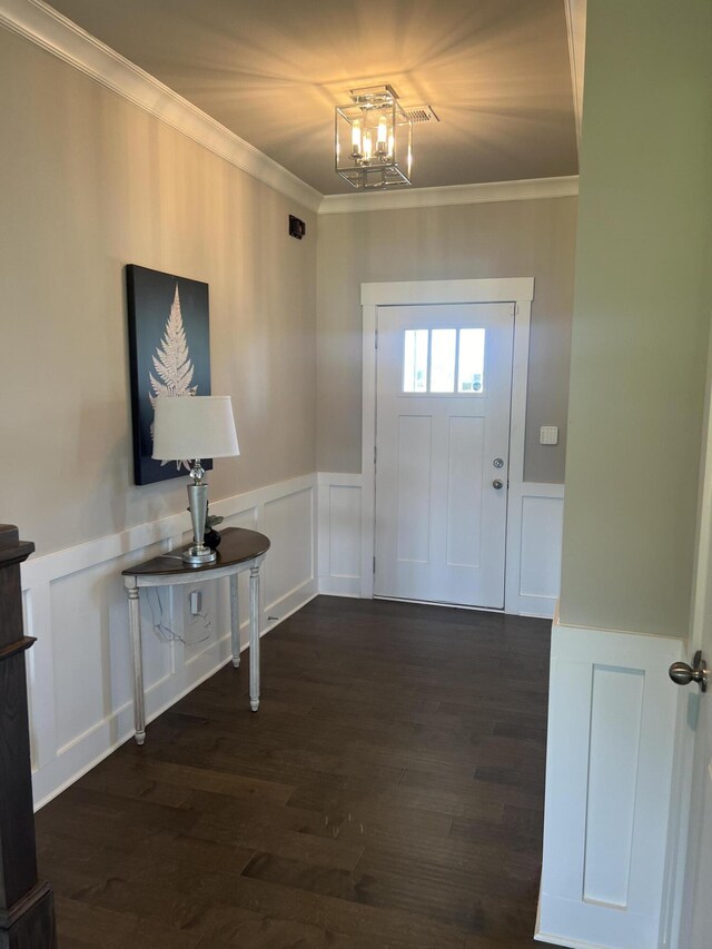 3309 Grassy Fields Ln, Apison, TN 37302 - foyer entrance with a decorative wall, a wainscoted wall, crown molding, wood finished floors, and a chandelier