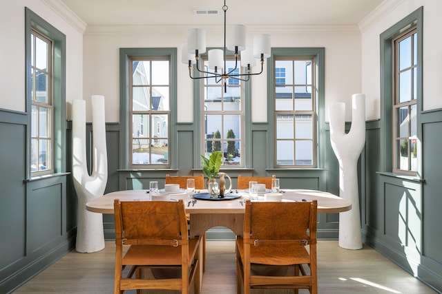 1399 Little Sorrel Rd Unit 30, Hixson, TN 37343 - dining area with a chandelier, healthy amount of natural light, light wood-style floors, crown molding, and a decorative wall