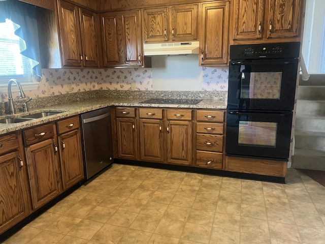 19 Hickory Ln, Fort Oglethorpe, GA 30742 - kitchen featuring black appliances, under cabinet range hood, light stone counters, and brown cabinets