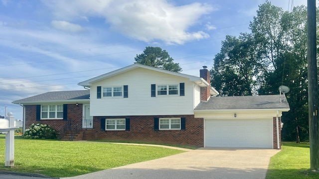 19 Hickory Ln, Fort Oglethorpe, GA 30742 - split level home featuring brick siding, driveway, a garage, a front lawn, and a chimney