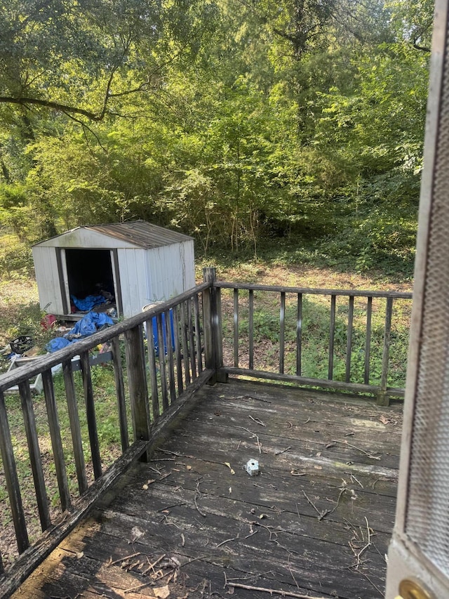 3024 Lightfoot Mill Rd, Chattanooga, TN 37406 - wooden deck featuring a storage unit and a wooded view