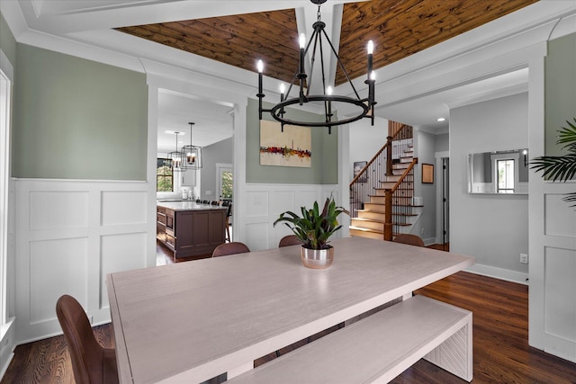 12951 Blakeslee Dr, Soddy Daisy, TN 37379 - dining room with a chandelier, healthy amount of natural light, wainscoting, dark wood-style flooring, and stairway