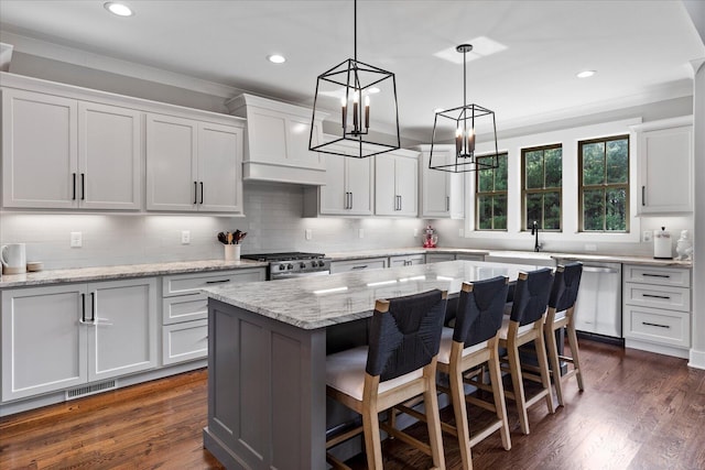 12951 Blakeslee Dr, Soddy Daisy, TN 37379 - kitchen featuring premium range hood, stainless steel appliances, a chandelier, a kitchen breakfast bar, and recessed lighting