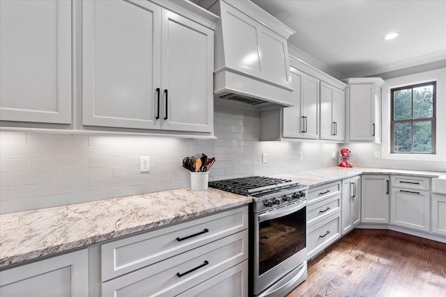 12951 Blakeslee Dr, Soddy Daisy, TN 37379 - kitchen featuring gas stove, custom exhaust hood, backsplash, dark wood-style flooring, and light stone counters