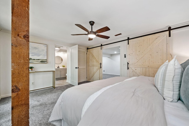 507 Big Stump Mountain Trl, Jasper, GA 30143 - bedroom with a barn door, carpet, ensuite bathroom, and a ceiling fan
