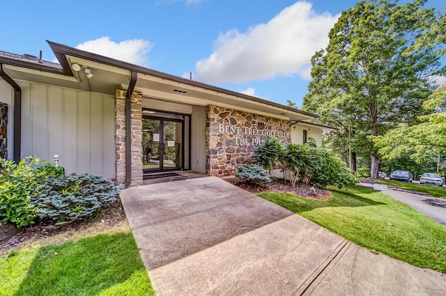 507 Big Stump Mountain Trl, Jasper, GA 30143 - property entrance featuring stone siding, board and batten siding, and french doors