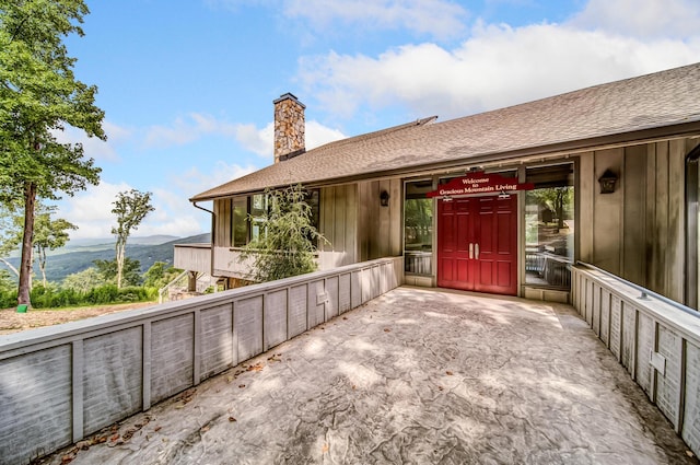 507 Big Stump Mountain Trl, Jasper, GA 30143 - doorway to property with a chimney, a mountain view, and roof with shingles