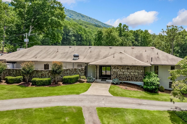 507 Big Stump Mountain Trl, Jasper, GA 30143 - view of front of property with stone siding, a front lawn, a mountain view, and a shingled roof