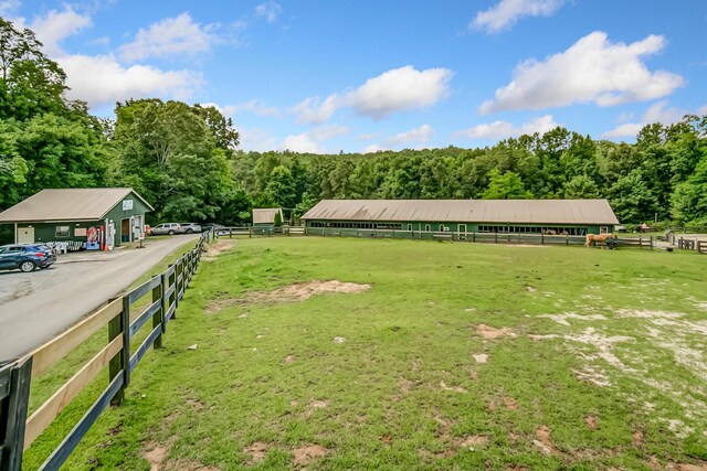 507 Big Stump Mountain Trl, Jasper, GA 30143 - view of yard featuring a view of trees, an outdoor structure, an exterior structure, and an enclosed riding area