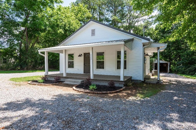 409 Hall St, Lafayette, GA 30728 - view of front facade with covered porch, gravel driveway, and an outdoor structure