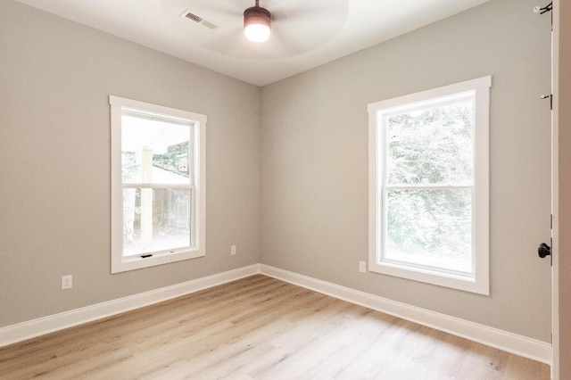 409 Hall St, Lafayette, GA 30728 - empty room with ceiling fan, light wood-type flooring, and plenty of natural light
