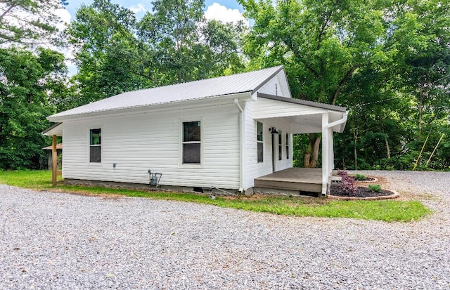 409 Hall St, Lafayette, GA 30728 - view of home's exterior with a porch, a metal roof, driveway, and crawl space