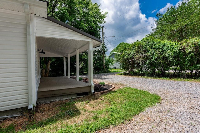 409 Hall St, Lafayette, GA 30728 - view of yard featuring gravel driveway and covered porch