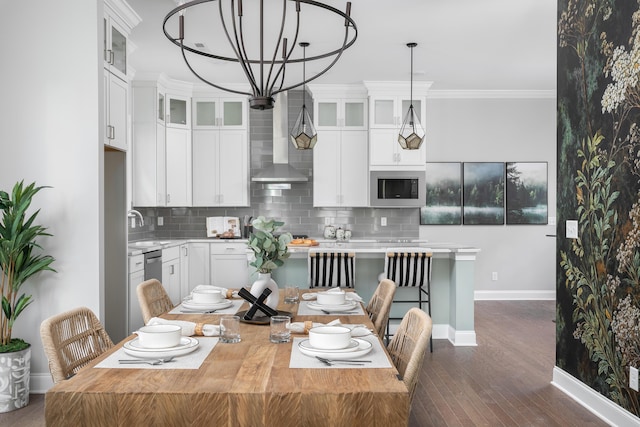 147 Honeycomb Ln, Chattanooga, TN 37421 - dining area with dark wood-type flooring, ornamental molding, and a chandelier