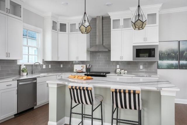 147 Honeycomb Ln, Chattanooga, TN 37421 - kitchen with stainless steel appliances, wall chimney range hood, a center island, dark wood-type flooring, and ornamental molding