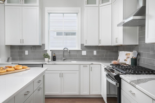 147 Honeycomb Ln, Chattanooga, TN 37421 - kitchen featuring wall chimney exhaust hood, stainless steel range with gas stovetop, and white cabinets