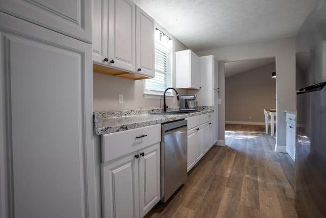316 Old Hales Gap Rd, Trenton, GA 30752 - kitchen with appliances with stainless steel finishes, white cabinets, dark wood-style flooring, a textured ceiling, and light stone counters