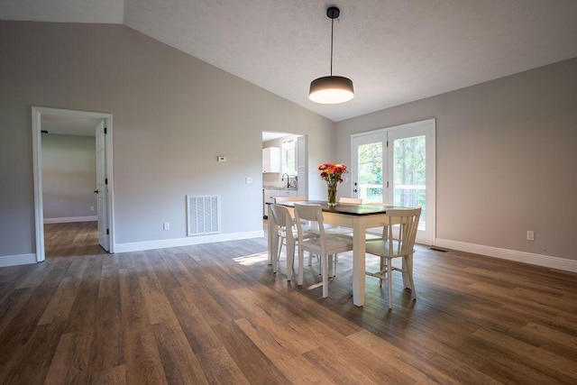 316 Old Hales Gap Rd, Trenton, GA 30752 - dining area with vaulted ceiling and dark wood-style floors