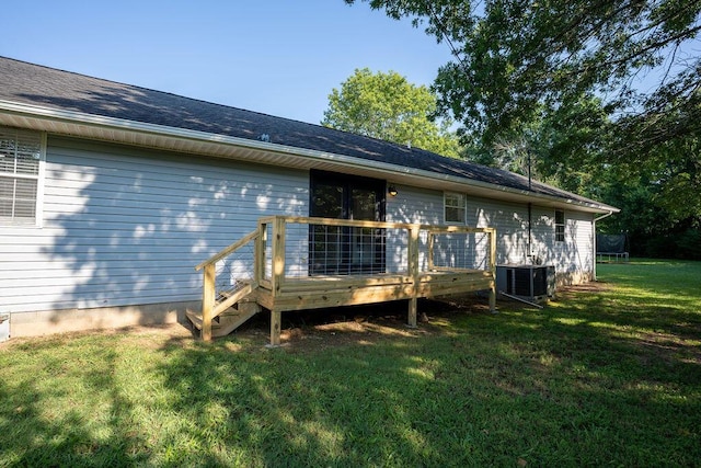 316 Old Hales Gap Rd, Trenton, GA 30752 - back of property featuring a wooden deck, a trampoline, and a lawn