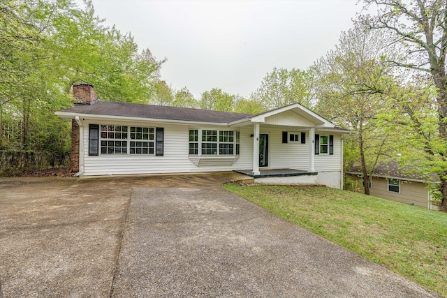 3706 Altamira Dr, Chattanooga, TN 37412 - ranch-style house with driveway, a chimney, covered porch, and a front yard